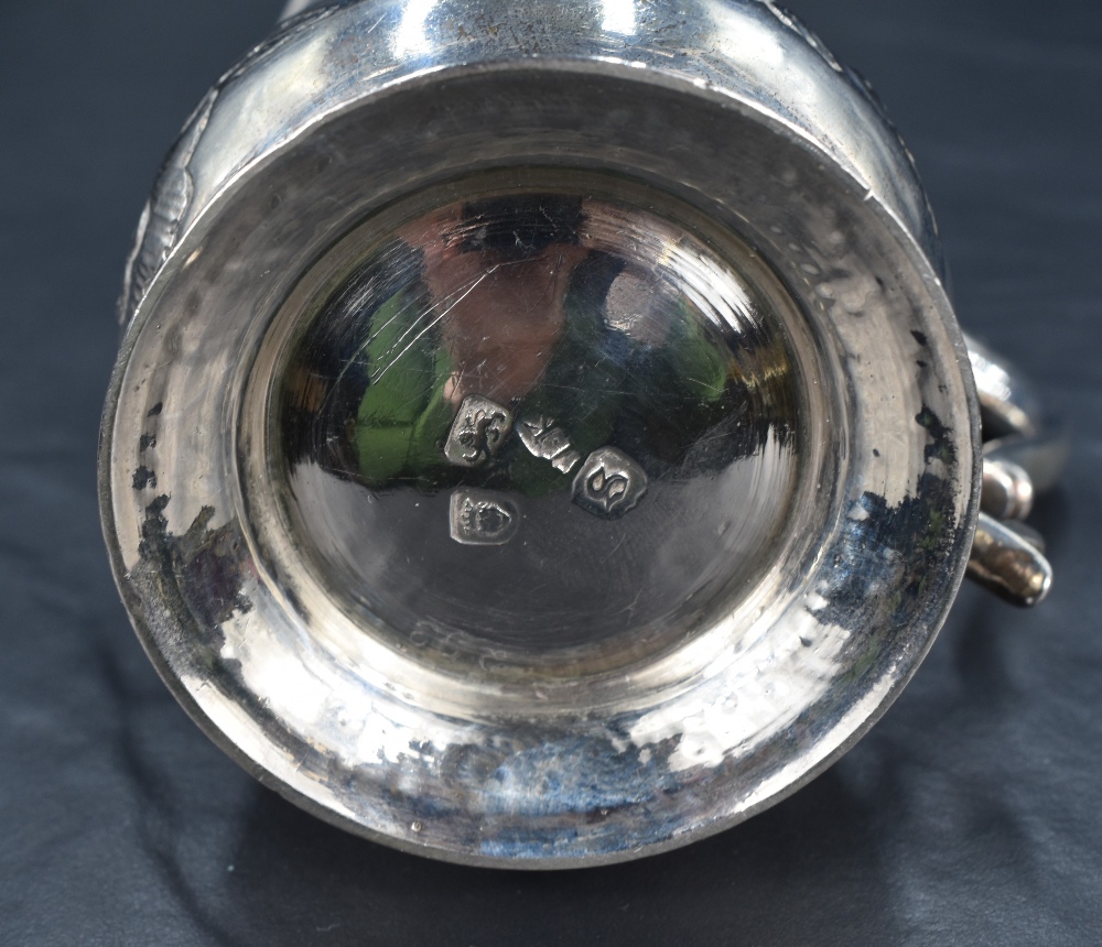 A George III silver tankard of baluster form, having a slightly flared rim and scroll handle, raised - Image 4 of 4