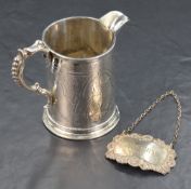 A Victorian silver tankard style jug, of cylindrical form having a narrow pointed rim opposed by a