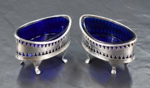 A pair of Scottish George III silver salts, of elliptical form with reeded rims over repeating