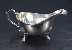 A Queen Elizabeth II silver sauce boat, of traditional form with reeded foliate ornamented rim,