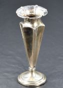 A late Victorian silver weighted vase, having a flared conforming rim and concave geometric