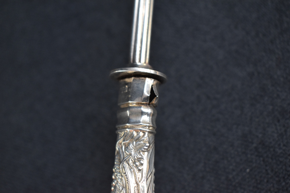 A 19th century silver and white metal candle snuffer, the silver embossed handle of a foliage design - Image 6 of 6