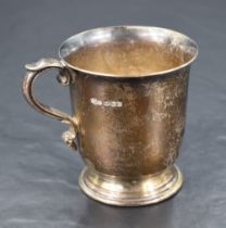 A George VI silver cup, of plain cylindrical form with scrolled handle, flared rim and stepped
