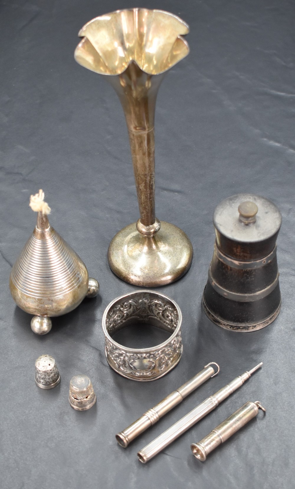 A Victorian table lighter having a bulbous form with ring moulded decoration raised on three orb