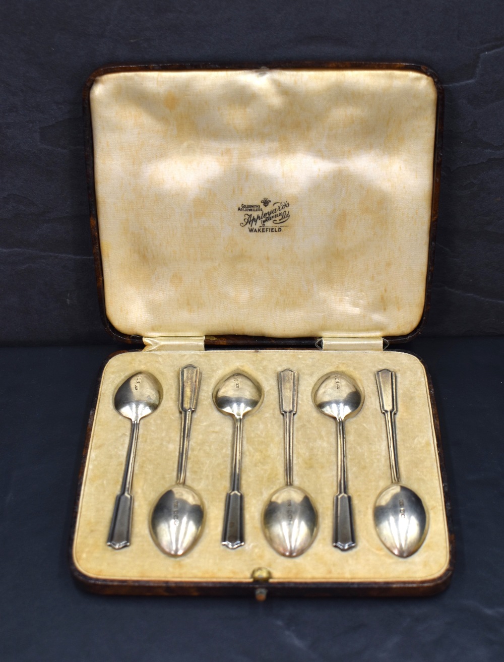 A cased set of six George VI teaspoons, having decorative enamel to terminals, marks for