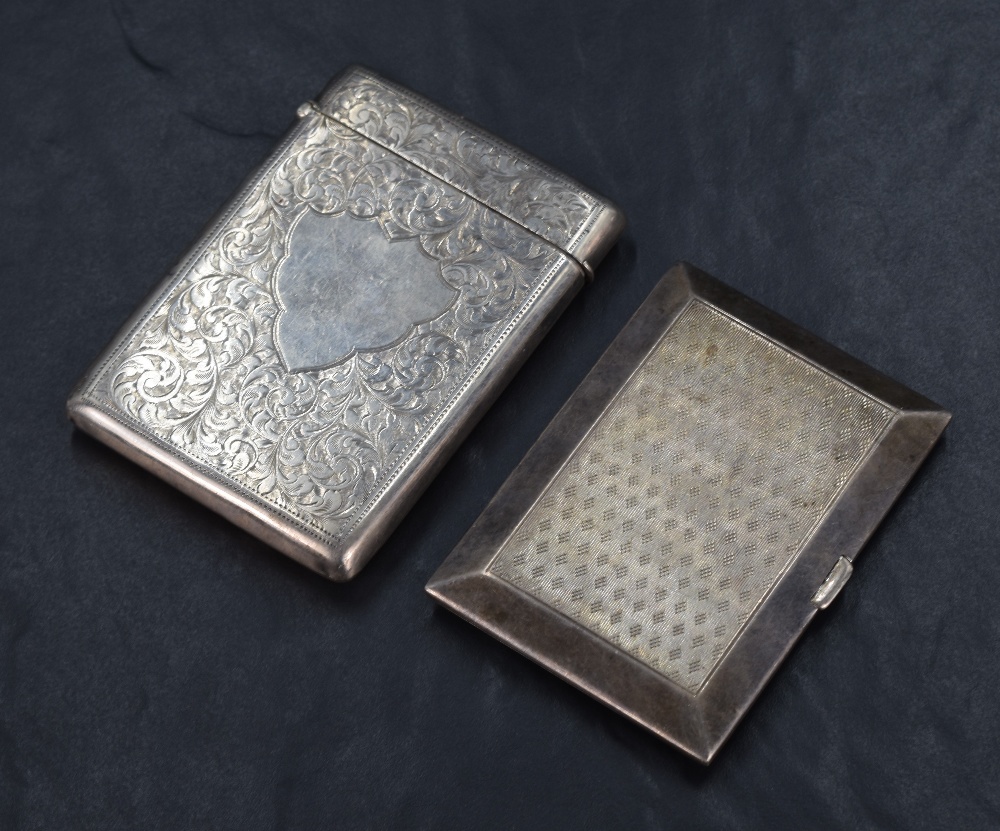 A George V silver cigarette case of rectangular form, having engine turned decoration to both sides,