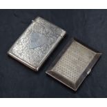A George V silver cigarette case of rectangular form, having engine turned decoration to both sides,