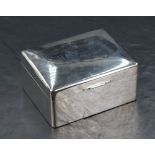 An early Queen Elizabeth II silver cigarette box, of hinged rectangular form with wooden lined