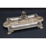 A Victorian silver inkstand, of rectangular form, with egg-and-dart moulded rim, lobed inkwell