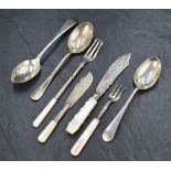 A selection of silver flatware and cutlery comprising a George V silver pickle fork with mother-of-