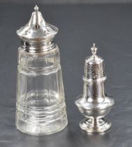 A George V silver topped cut-glass sugar caster, marks for Birmingham 1932, maker W I Broadway & Co,