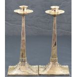 After Jan Eisenloeffel, a pair of attractive silver Arts & Crafts candlesticks, having slightly