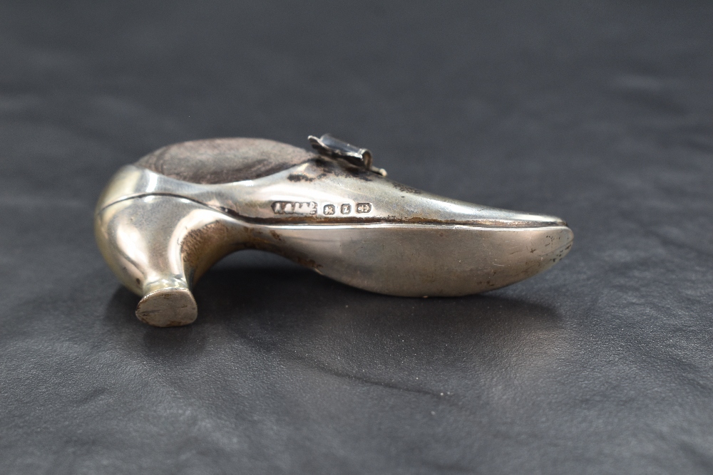 A late Victorian silver novelty pin cushion modelled as a shoe with a decorative buckle, having dark - Image 4 of 4