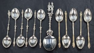 A set of six George V silver Apostle teaspoons, having ornate handles of scroll and twisted design