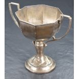 A George V silver trophy, of octagonal form with two angular handles, joined to the bowl and