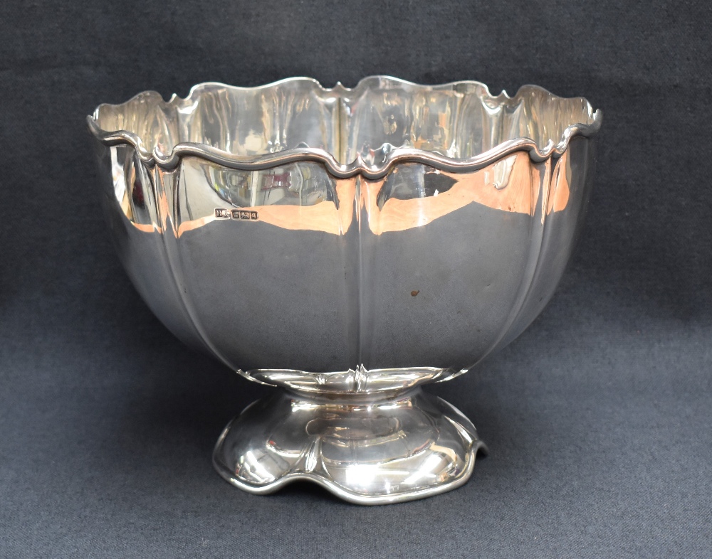 An Edwardian silver punch bowl, of circular lobed petal moulded design raised on a conforming - Image 2 of 4