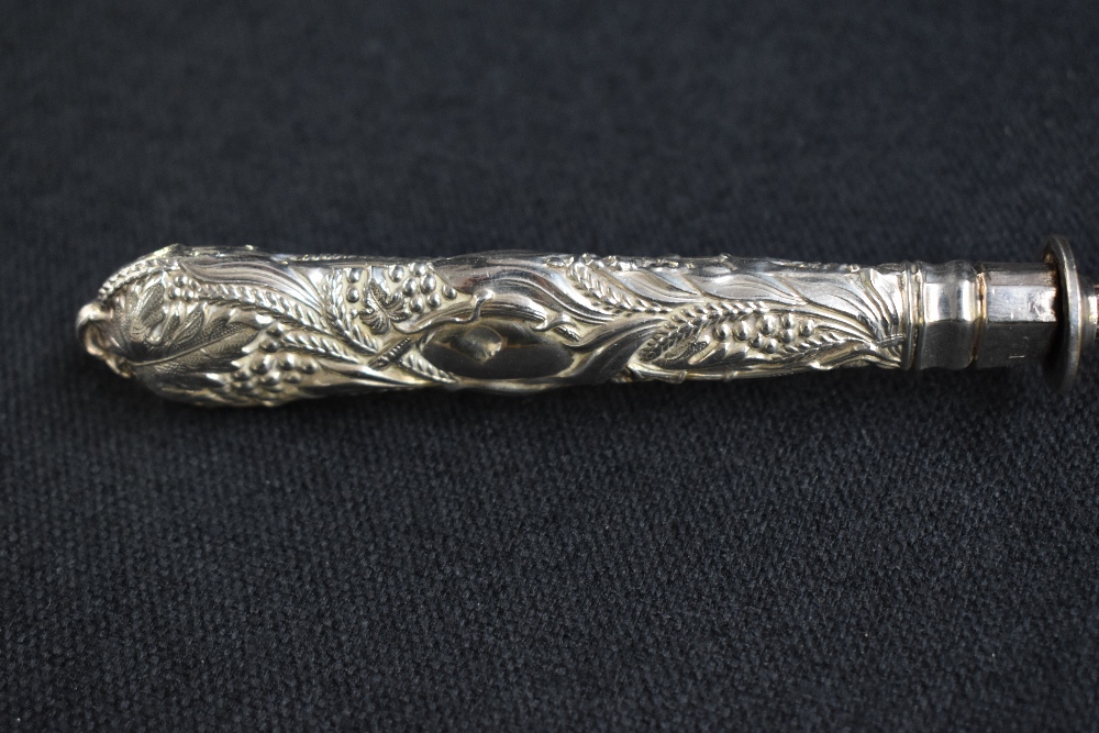 A 19th century silver and white metal candle snuffer, the silver embossed handle of a foliage design - Image 3 of 6