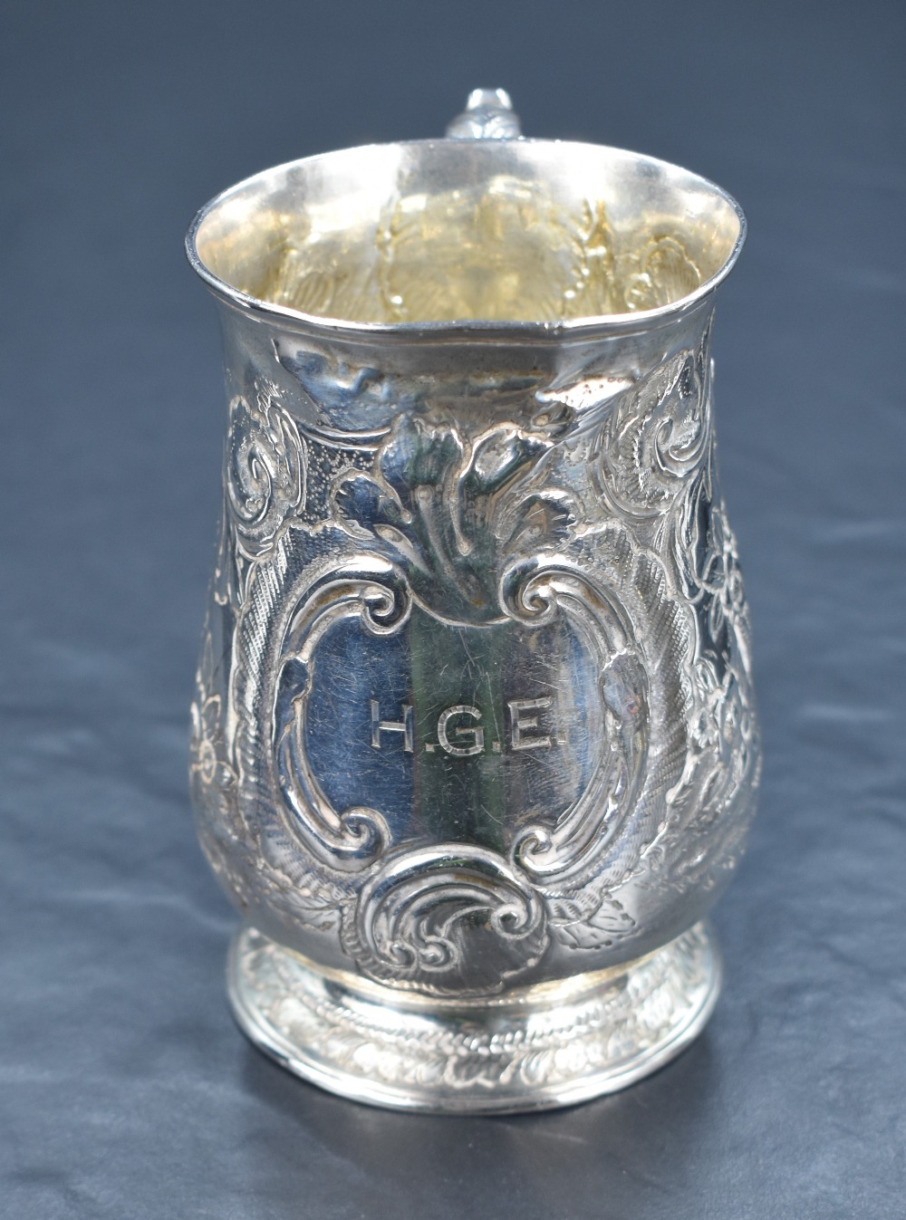 A George III silver tankard of baluster form, having a slightly flared rim and scroll handle, raised - Image 2 of 4