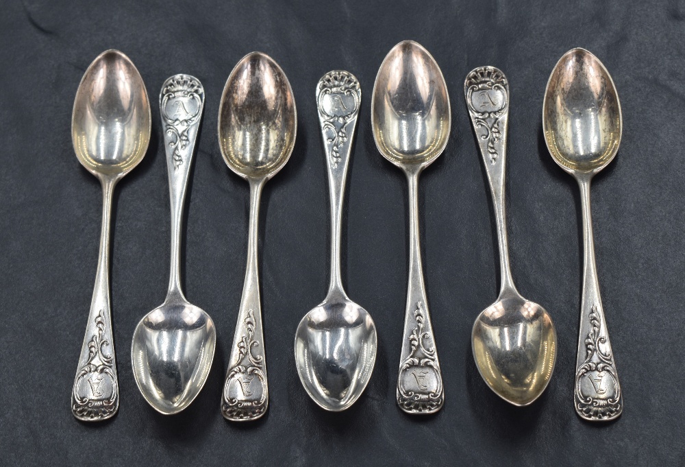 A set of seven late Victorian teaspoons of Hanoverian design, having foliate scroll decoration and