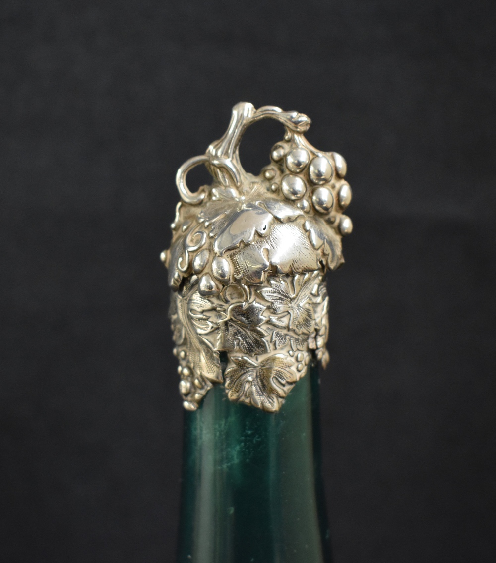A Victorian silver topped emerald green glass wine bottle, the silver top and mounting having a - Image 2 of 6