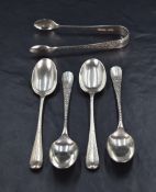 A set of four Edwardian silver teaspoons, Hanoverian rat-tail pattern having decorative floral
