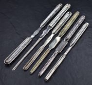 A group of six silver-plated marrow scoops, each of traditional design, including makers Joseph
