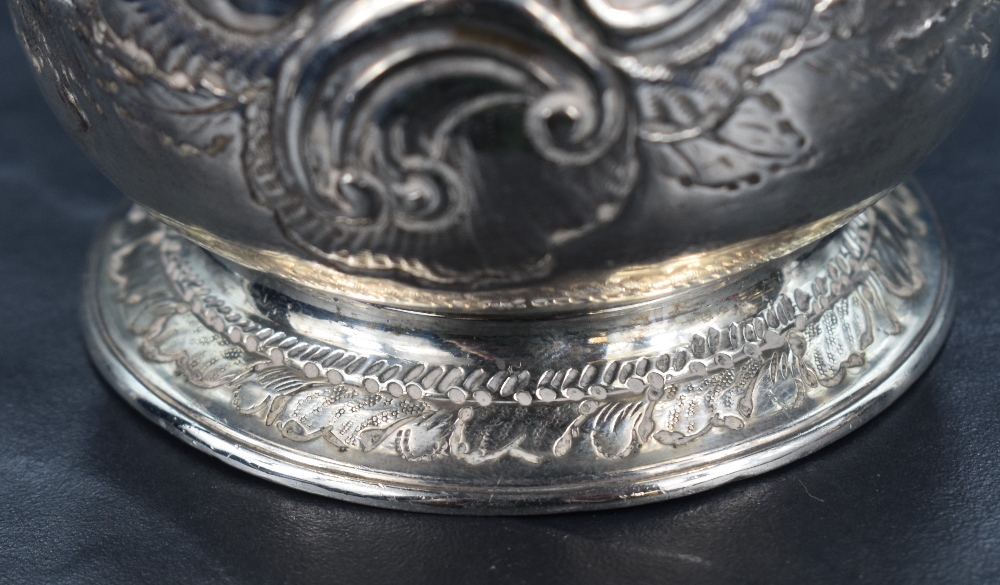 A George III silver tankard of baluster form, having a slightly flared rim and scroll handle, raised - Image 3 of 4