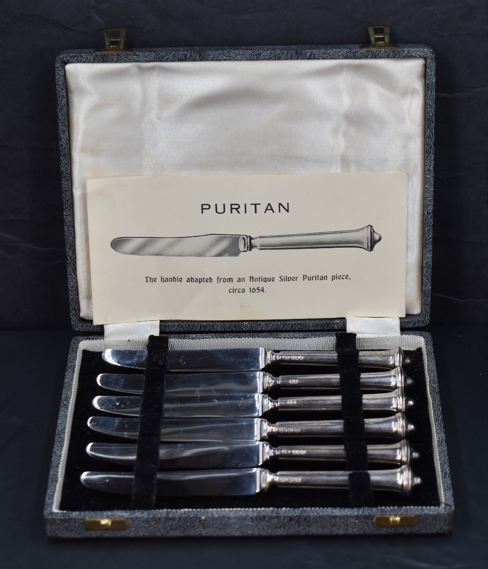 A set of six early Elizabeth II silver handled butter knives, having handles adapted from an antique