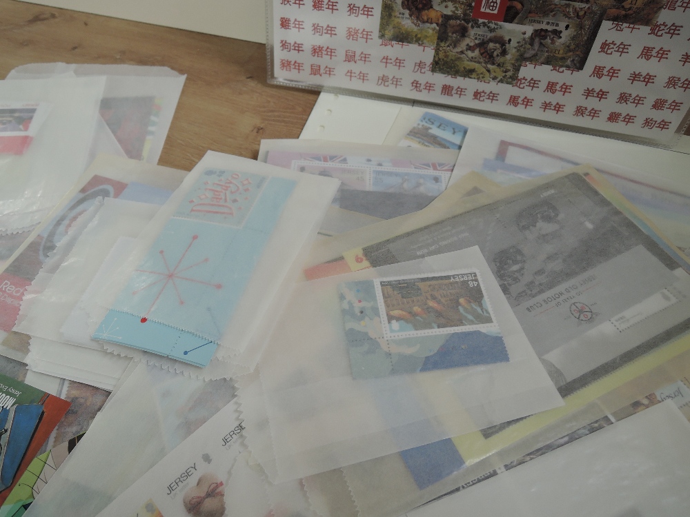 JERSEY MODERN COLLECTION OF MNH SETS & MINI SHEETS IN PACKETS 2010's ONWARDS Mass of packets with - Image 3 of 4