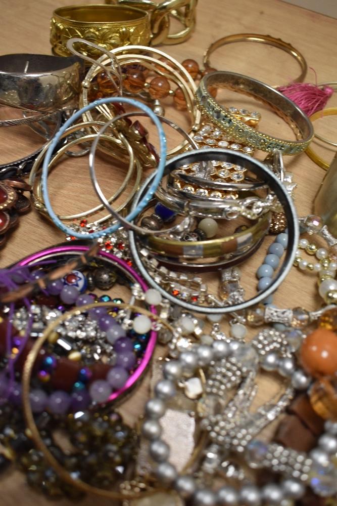 A large assortment of costume bracelets including bangles, statement cuff bracelets, beaded examples - Image 2 of 2