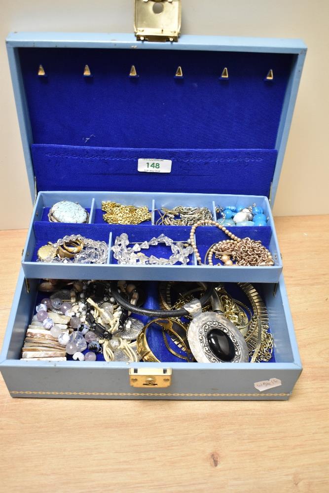 A mid-20th Century blue tooled leather jewellery box with contents, including a Celtic style