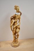 A large cast resin or ivory style figural study of a robed female with exotic birds, measuring