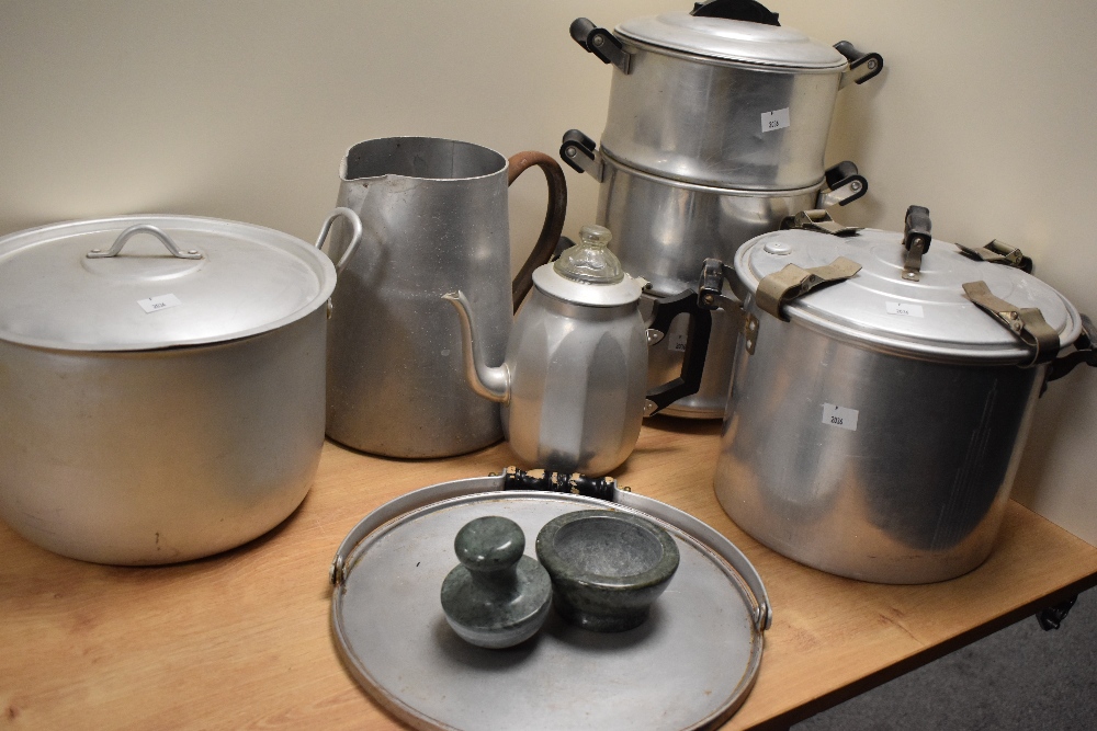 A collection of vintage aluminium pots, pans, pressure cooker etc.