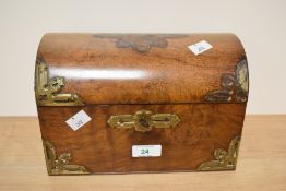 A 19th century walnut veneered writing compendium, having brass fitting, internal compartments and