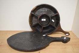 A primitive wooden compartmentalised spice tray, thought to be Indian.