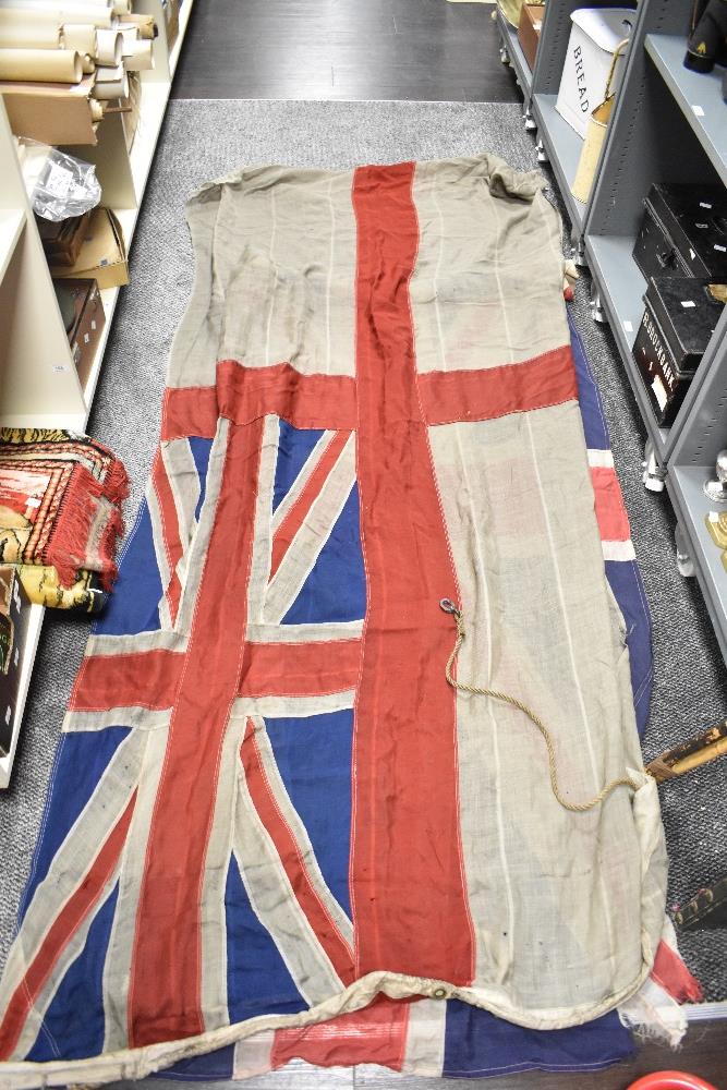 A large early 20th Century Royal Navy ensign flag, measuring 130cm x 235cm, another large Union Jack - Image 3 of 3