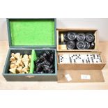 A vintage box of 32 turned wood chess pieces, together with two boxes of draughts counters and