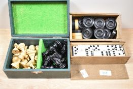 A vintage box of 32 turned wood chess pieces, together with two boxes of draughts counters and