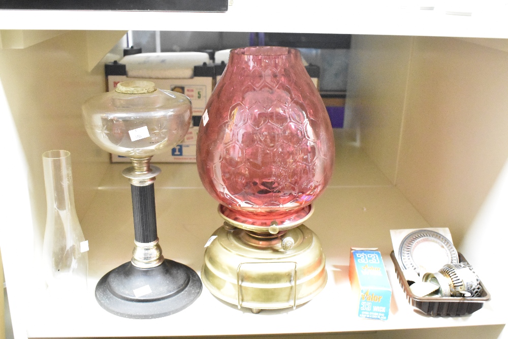 A late 19th Century brass oil lamp with cranberry glass shade, measuring 43cm high, together with - Image 2 of 2