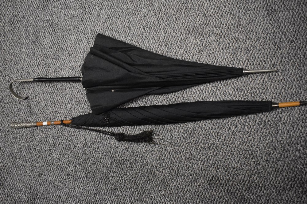 Two late 19th/early 20th Century parasols, the largest measures 95cm long