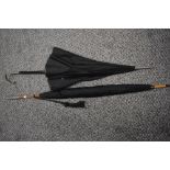 Two late 19th/early 20th Century parasols, the largest measures 95cm long