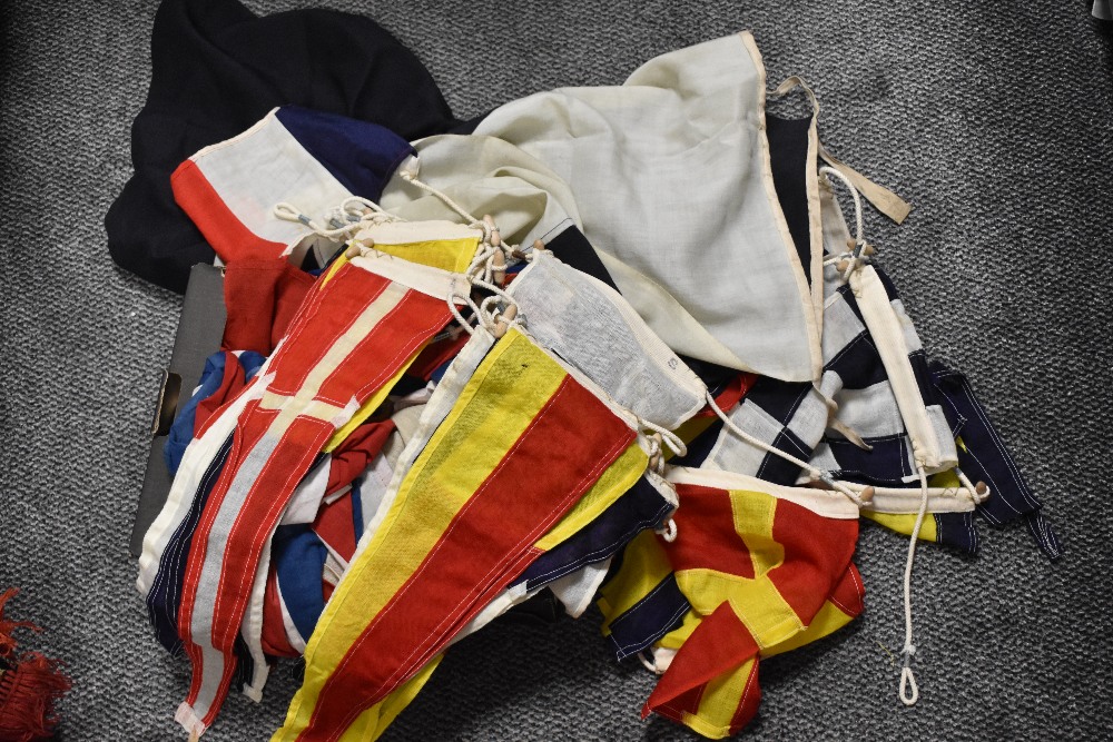 An assorted collection of early 20th Century naval flags and pennants