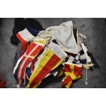 An assorted collection of early 20th Century naval flags and pennants