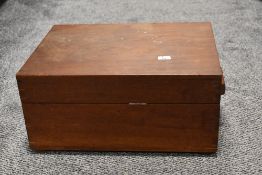 A vintage mahogany desk tidy, having internal compartments and tray, with key.