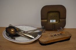 A vintage brass ashtray 'Aangeboden door het personeel, S.S Zafra', a clothes brush marked H.M.S.P