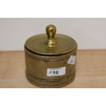 A Victorian brass lidded candy jar, of circular form, measuring 11cm tall