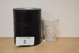 A late 19th / early 20th century medicine glass in case, with advertisement for H.W Herd, Chemist,