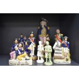 A collection of vintage figurines,of Lord Nelson interest, including Stafforshire pottery.