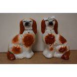 Two Staffordshire pottery dogs, approx 15cm high.