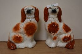 Two Staffordshire pottery dogs, approx 15cm high.